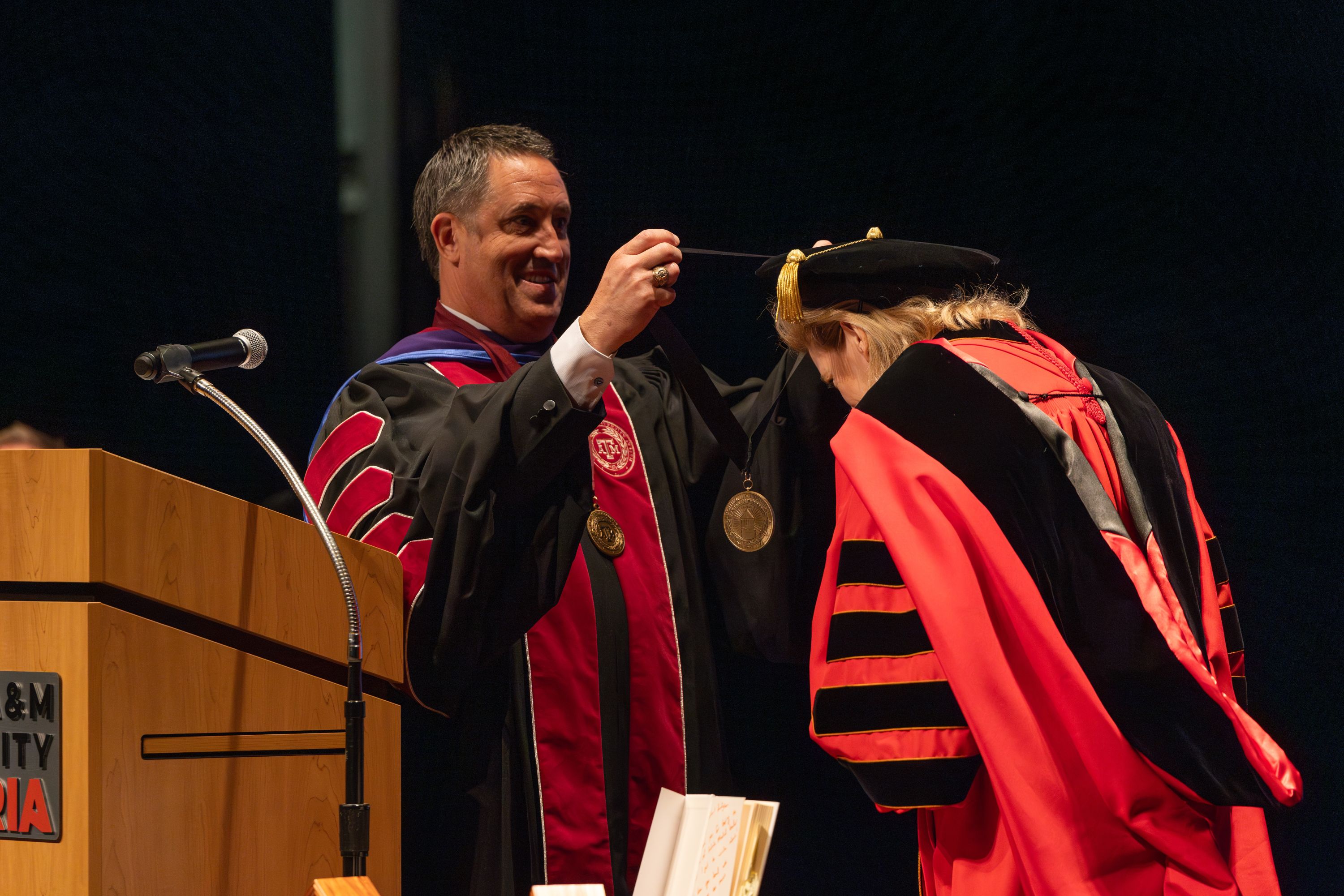 Chancellor Glenn Hegar puts the medallion of office on A&M-Victoria President Christian Hardigree.