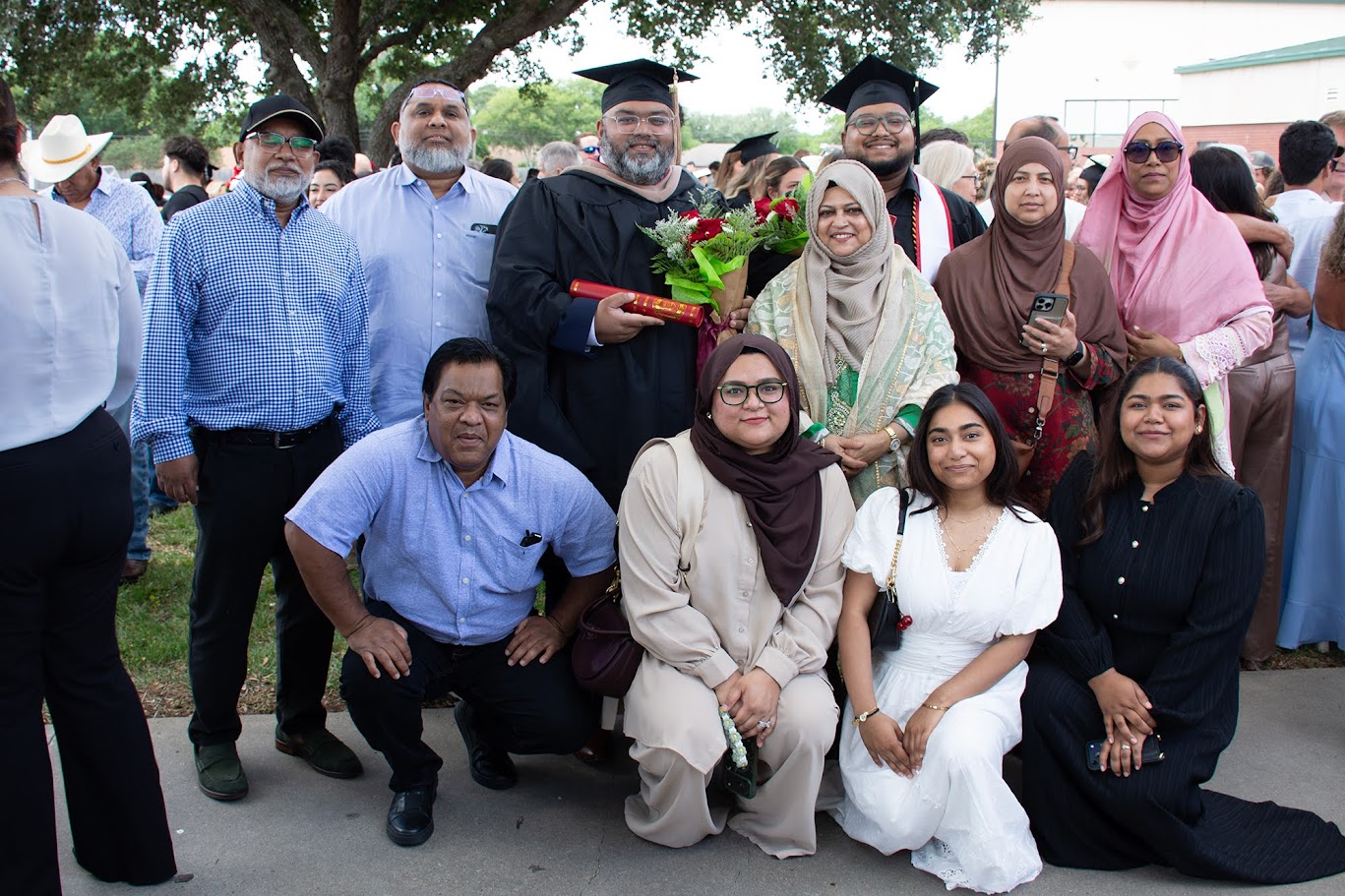 The Beg family poses together after the commencement ceremony.