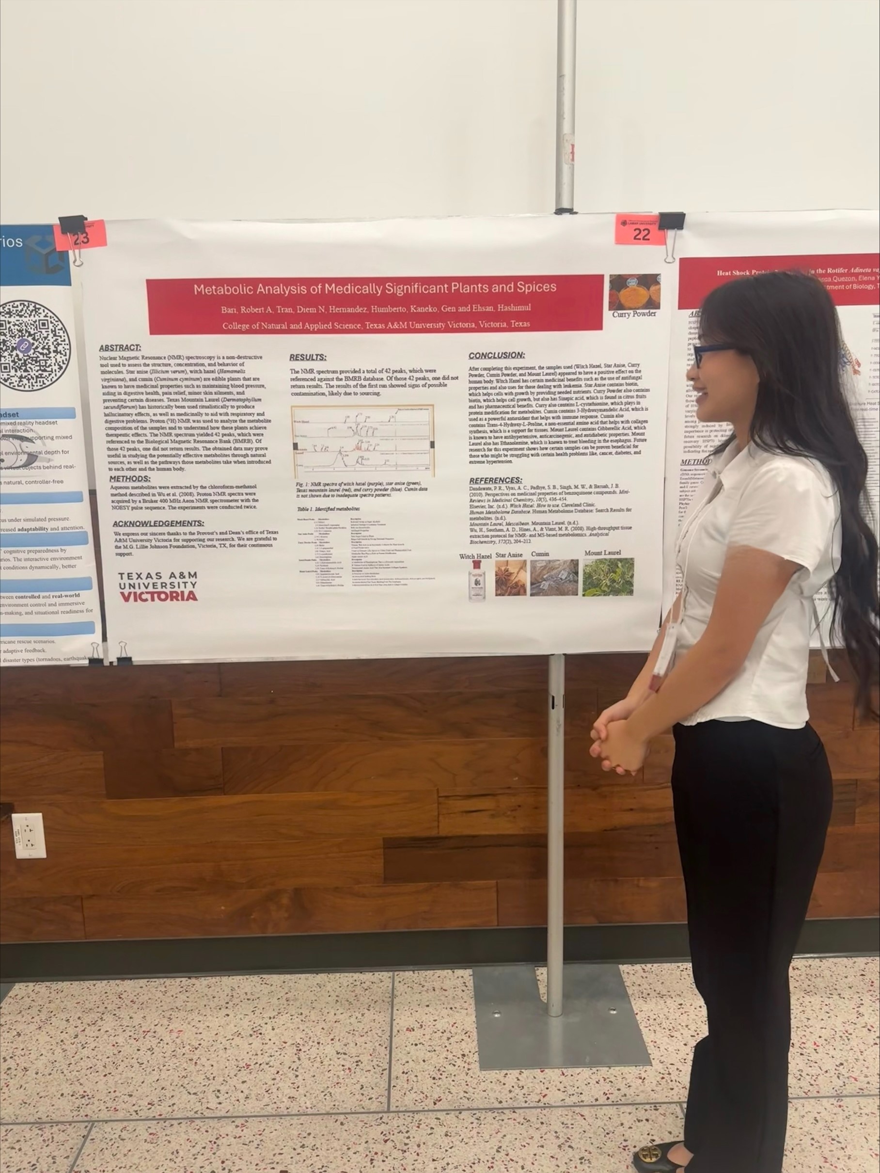 Diem Tran stands in front of her research poster.